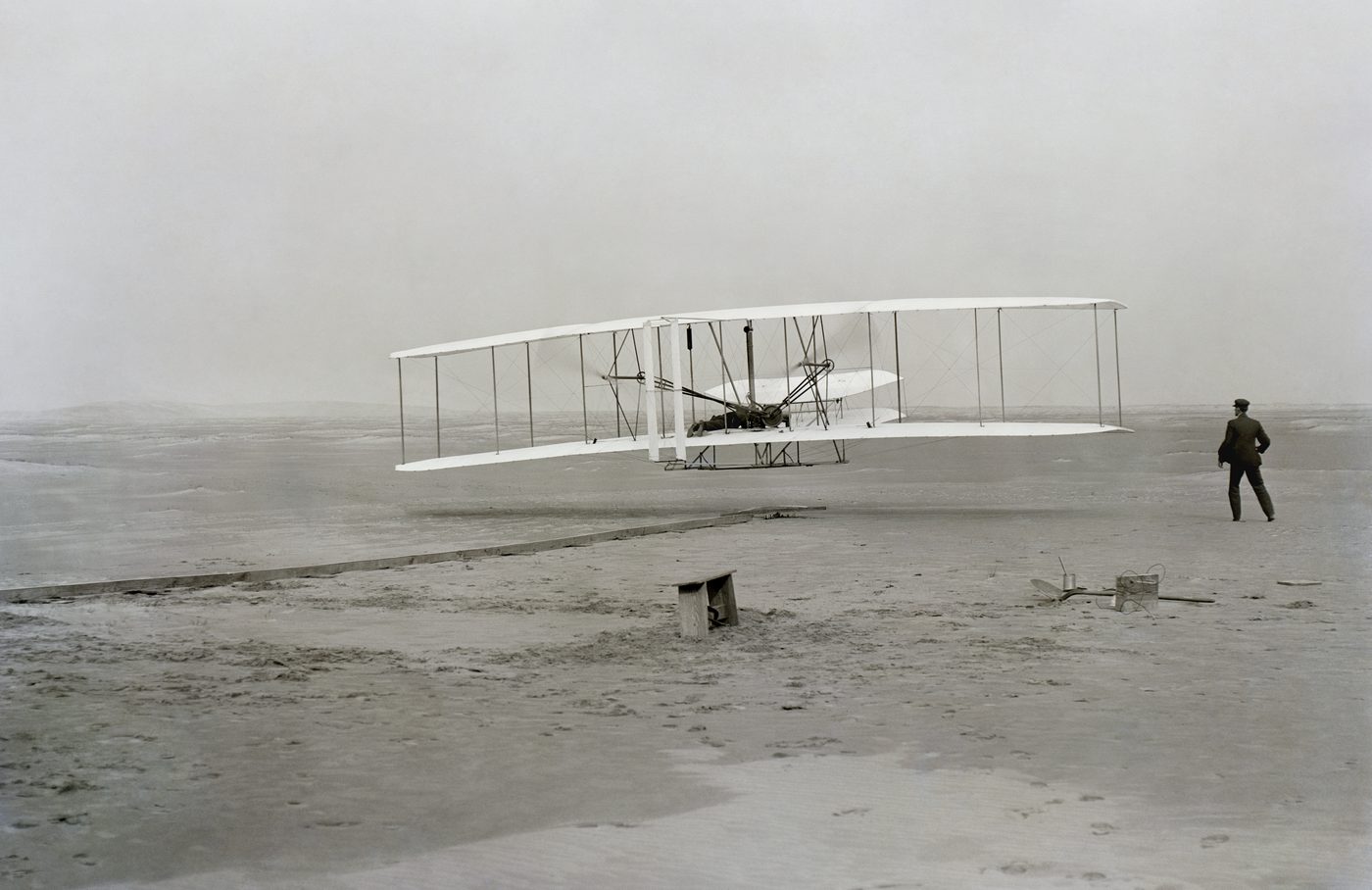 The Wright Flyer lifting off at Kitty Hawk, 17 December 1903 — John T. Daniels photograph
