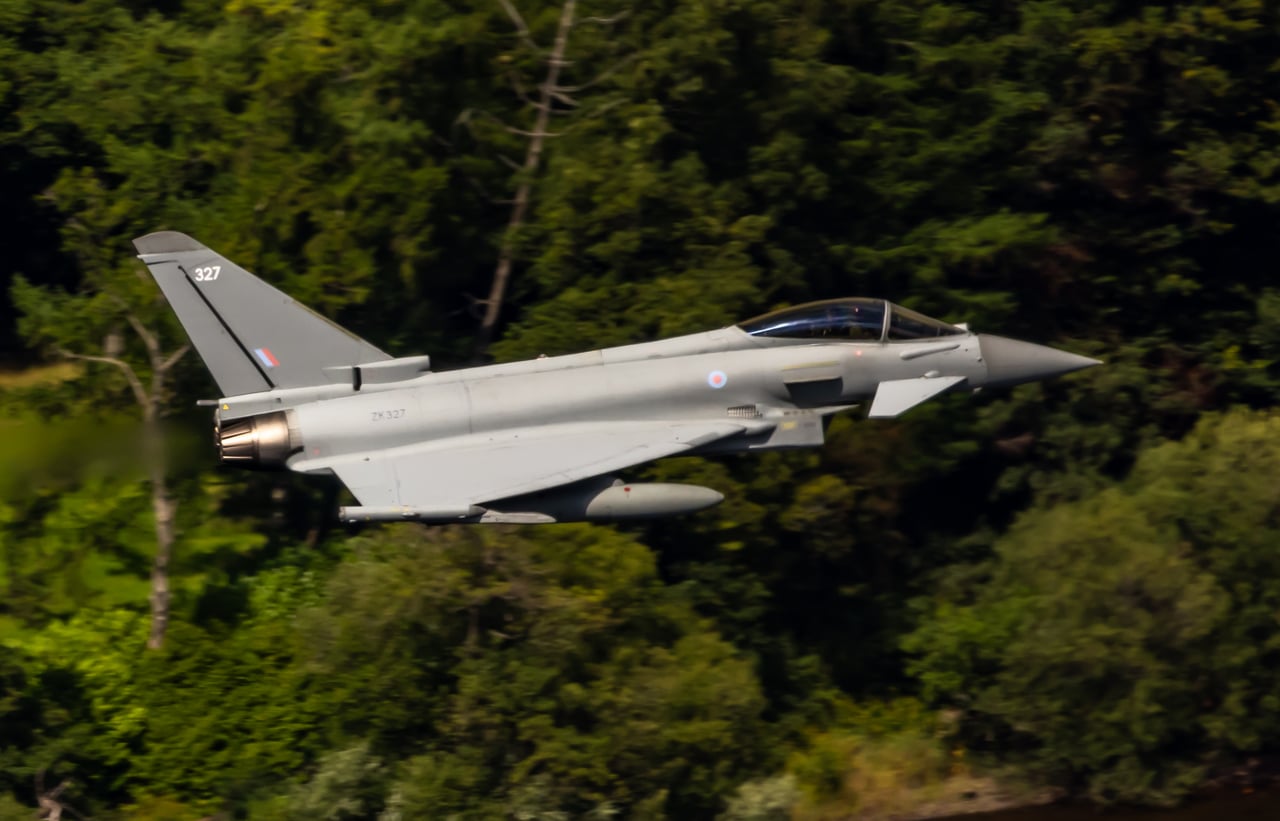 RAF Eurofighter Typhoon ZK327 low over forested hills