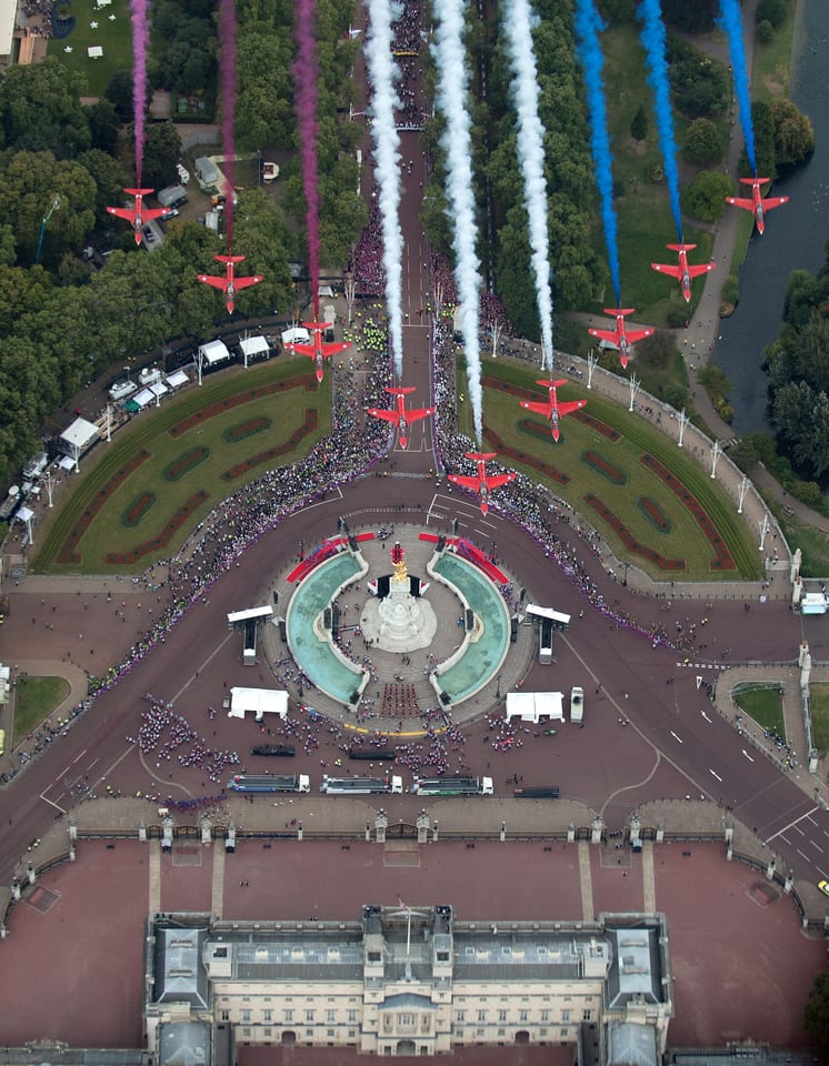 Red Arrows flying in formation over Buckingham Palace