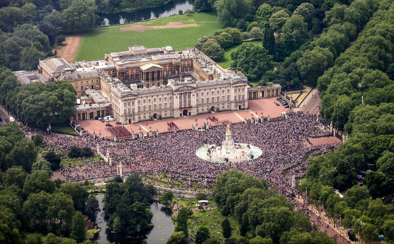 Crowds in front of Buckingham Palace and the Victoria Memorial during a flypast day