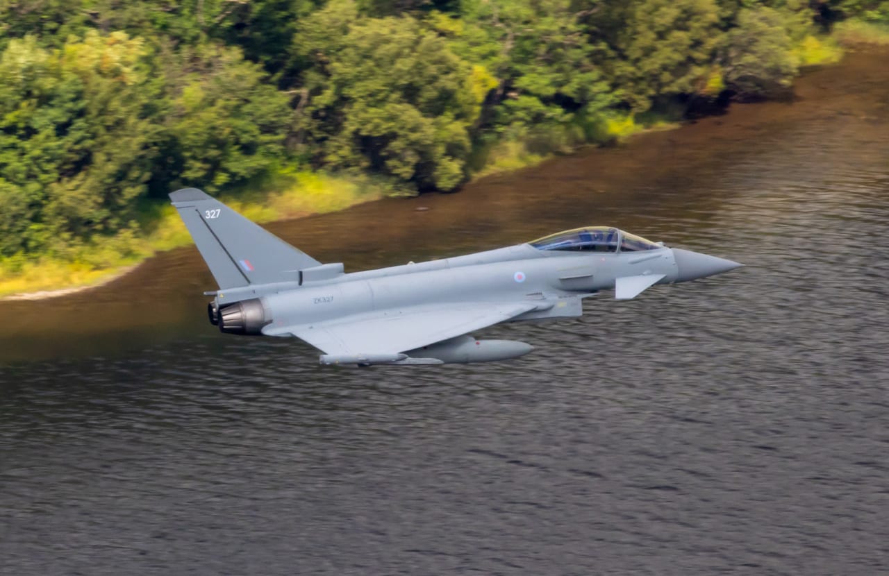 RAF Typhoon low through a Mach Loop valley