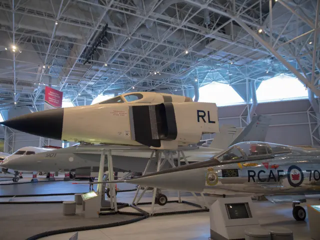 White nose section of the Avro Arrow marked RL on a stand, with Cold War jets behind