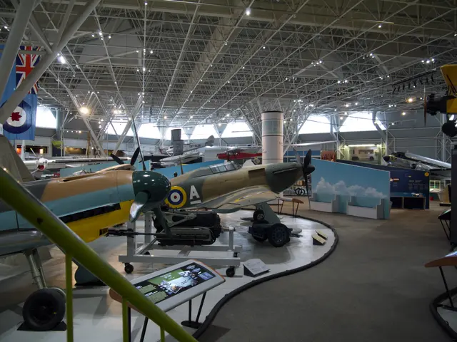 Hawker Hurricane in desert-and-green camouflage on display with Second World War exhibits around it