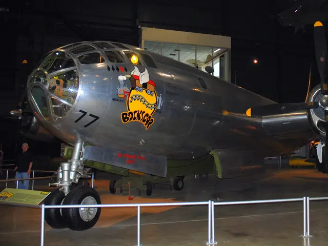 Side view of the silver B-29 Superfortress Bockscar in the museum hangar