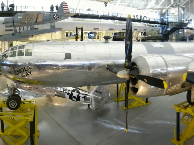 Panoramic view of the polished-metal B-29 Superfortress Enola Gay with its four propellers, in the hangar