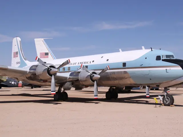 Four-engined propeller airliner in blue and white presidential livery