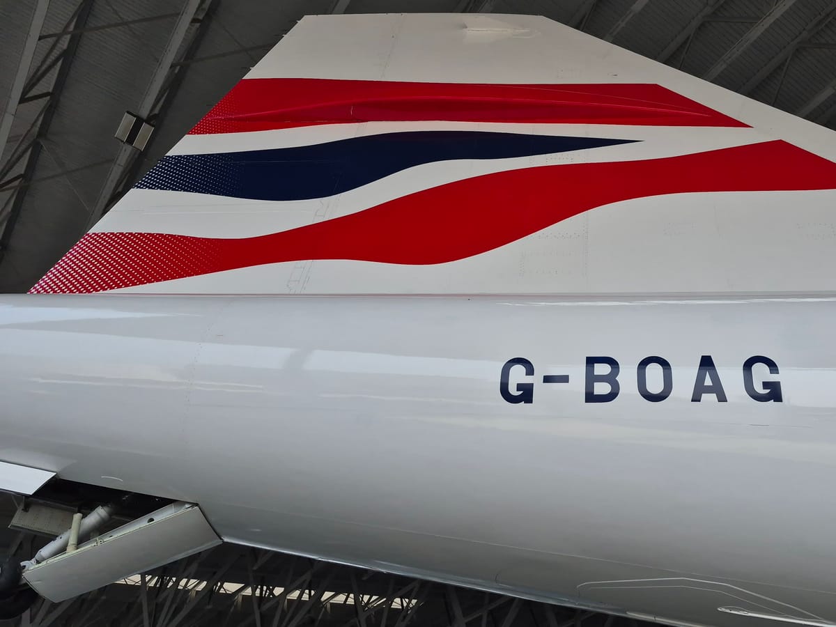 Tail fin of Concorde G-BOAG in British Airways Chatham Dockyard livery, registration painted on the rear fuselage