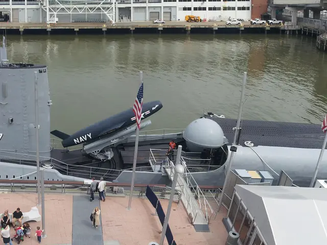 Panoramic view down onto the long dark hull of the submarine Growler with its missile hangar and Regulus missile